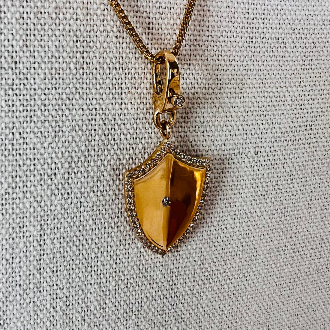 14k gold diamond folded shield pendant with enhancer bail