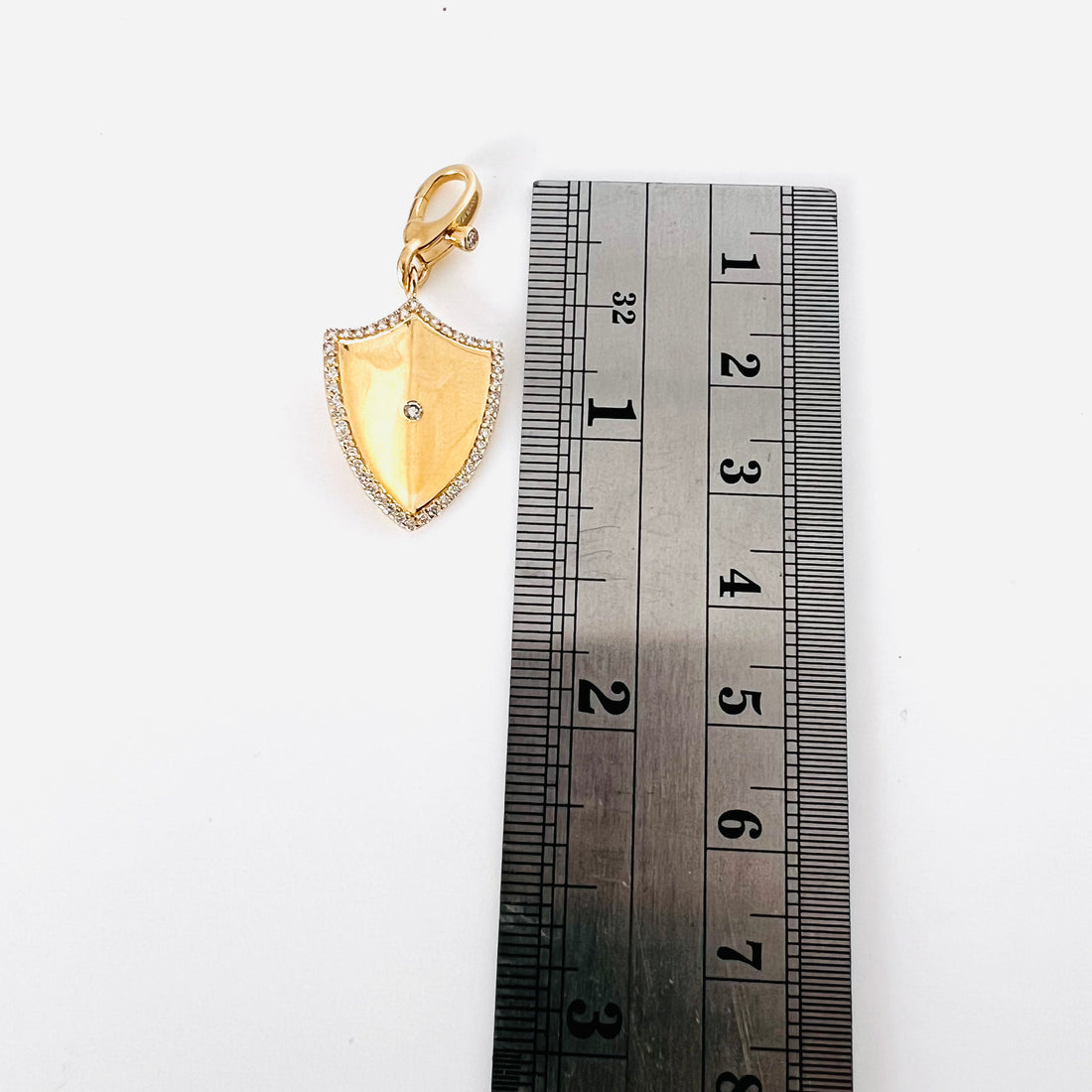 14k gold diamond folded shield pendant with enhancer bail