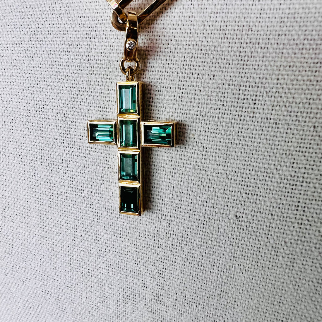 Gorgeous 14k and tourmaline cross pendant with single diamond enhancer bail