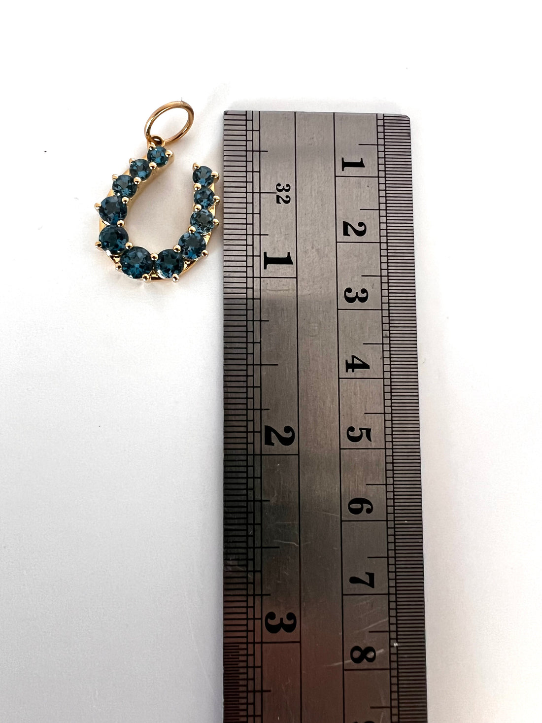 14k gold and London blue topaz horseshoe pendant