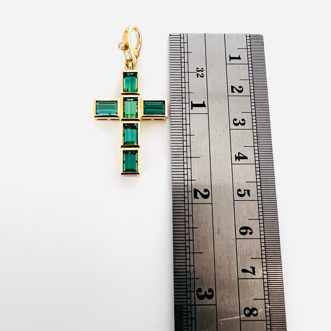 Gorgeous 14k and tourmaline cross pendant with single diamond enhancer bail