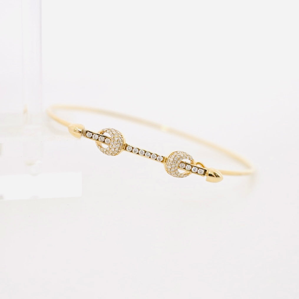 14k gold diamond bar wire bangle bracelet with two diamond knots