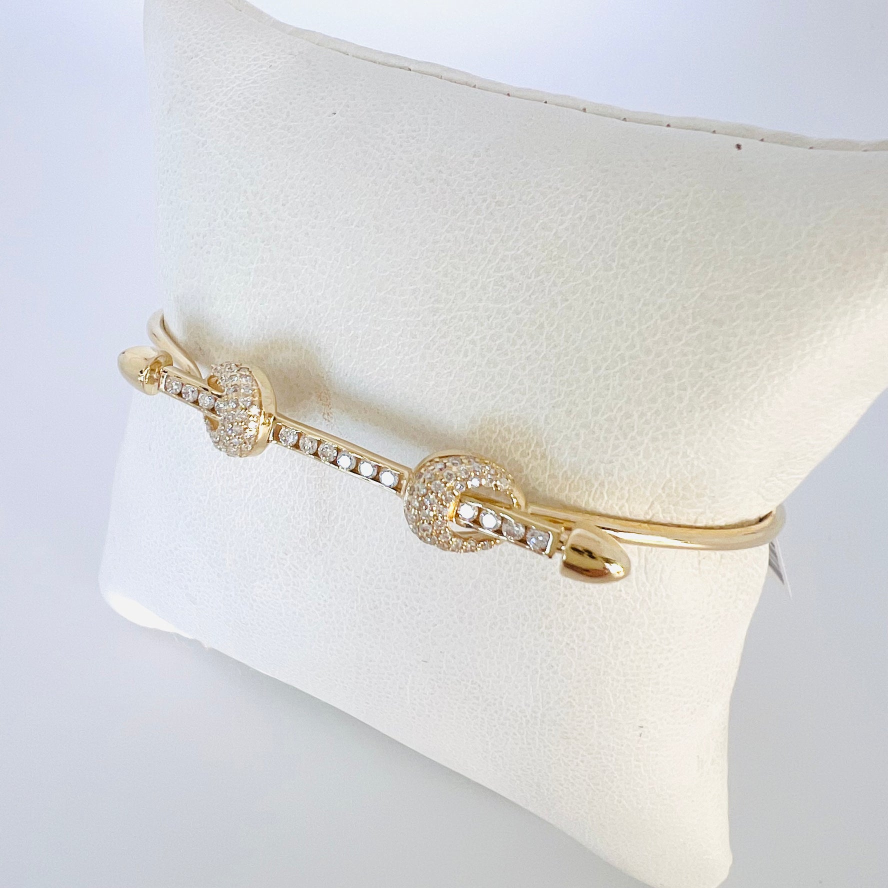 14k gold diamond bar wire bangle bracelet with two diamond knots