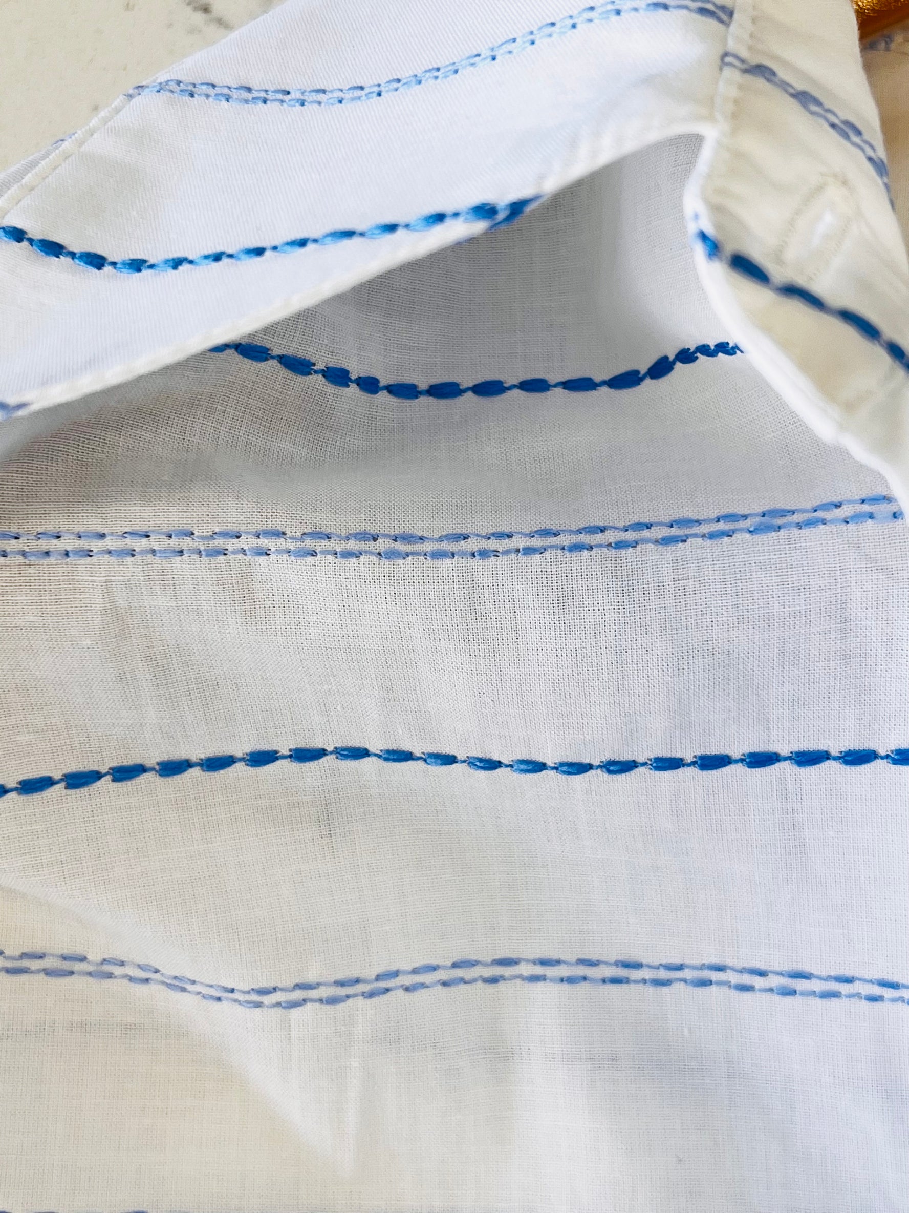the HATTIE top in horizontal blue embroidery