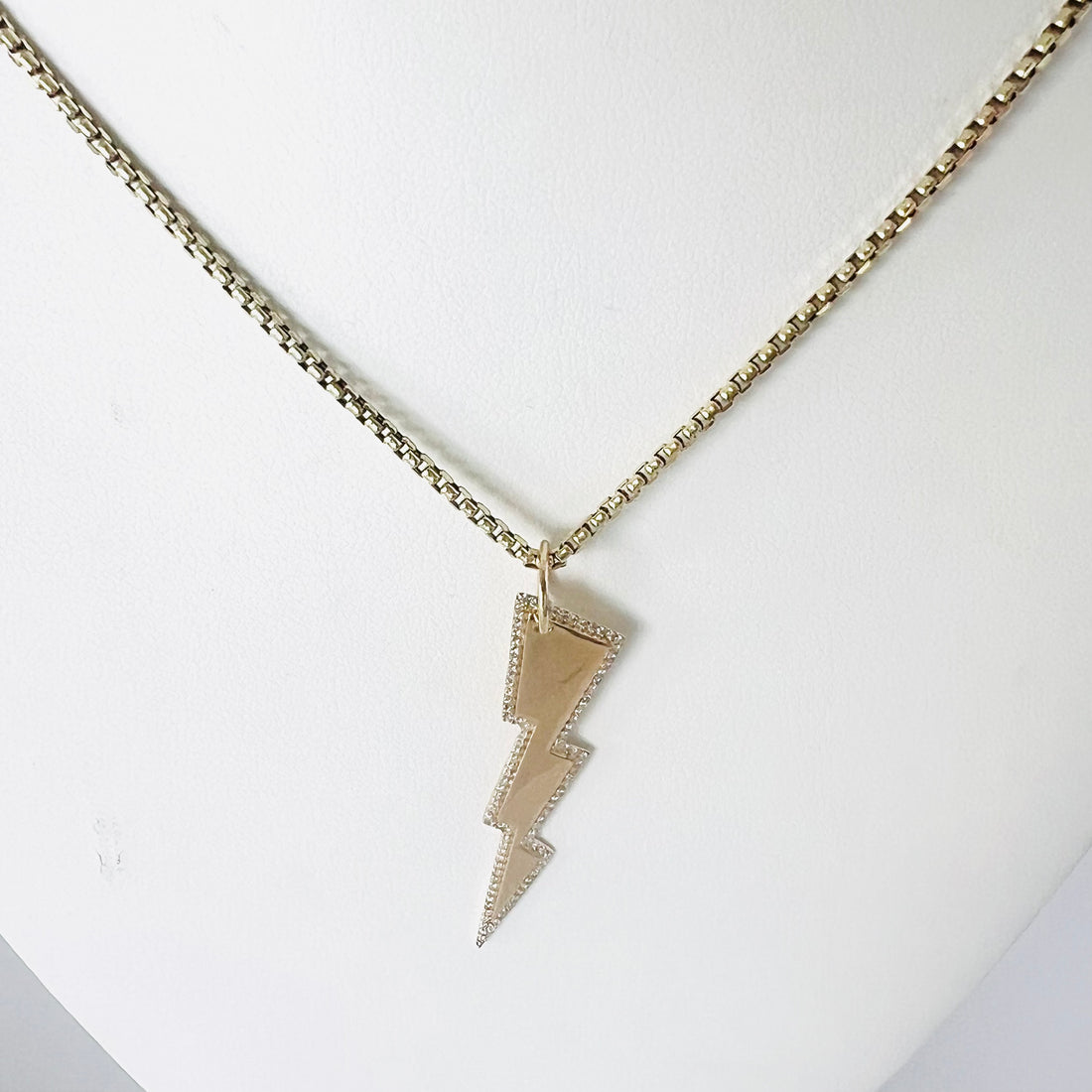 14k gold and diamond halo lightning bolt pendant