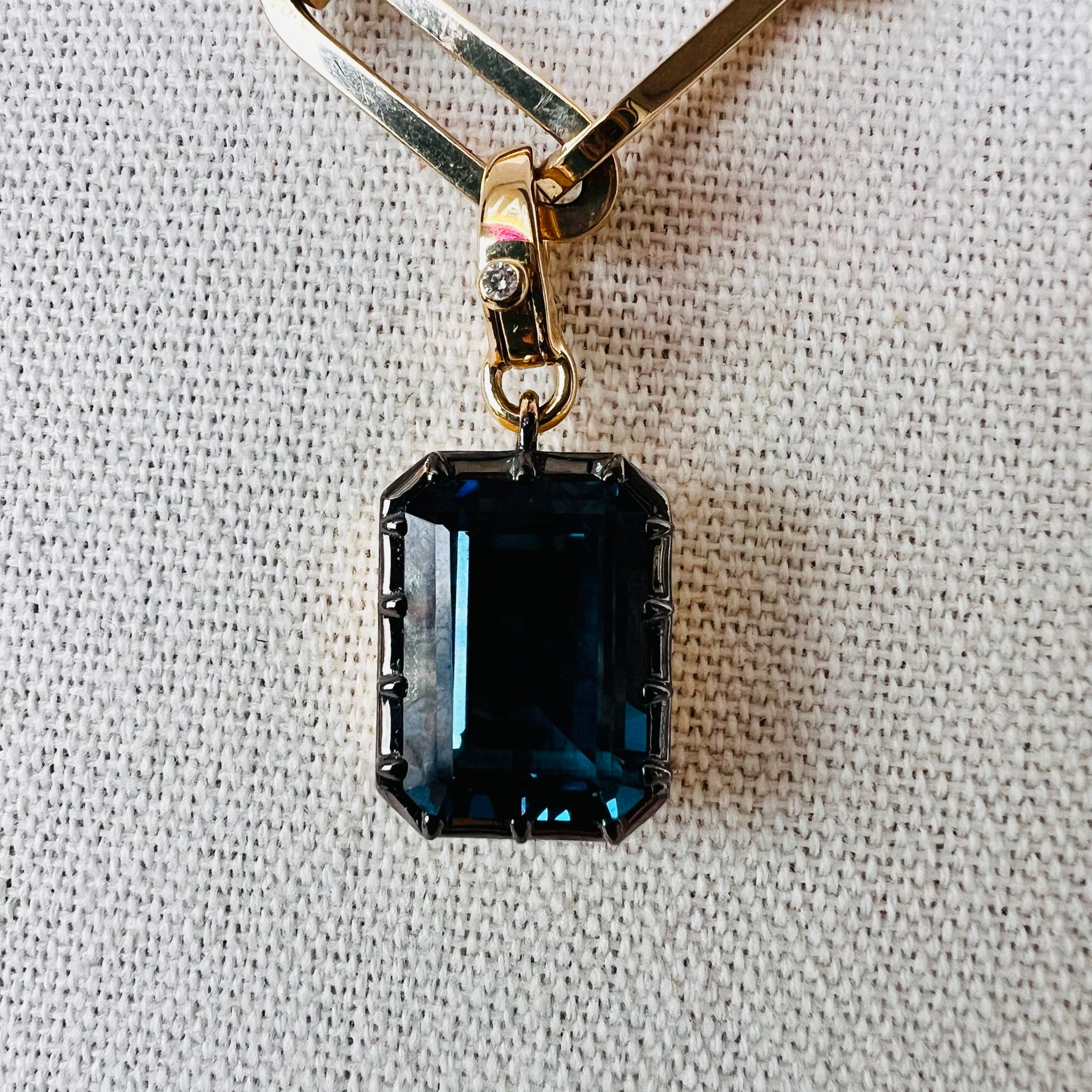 14k London topaz emerald pendant with single diamond enhancer bail
