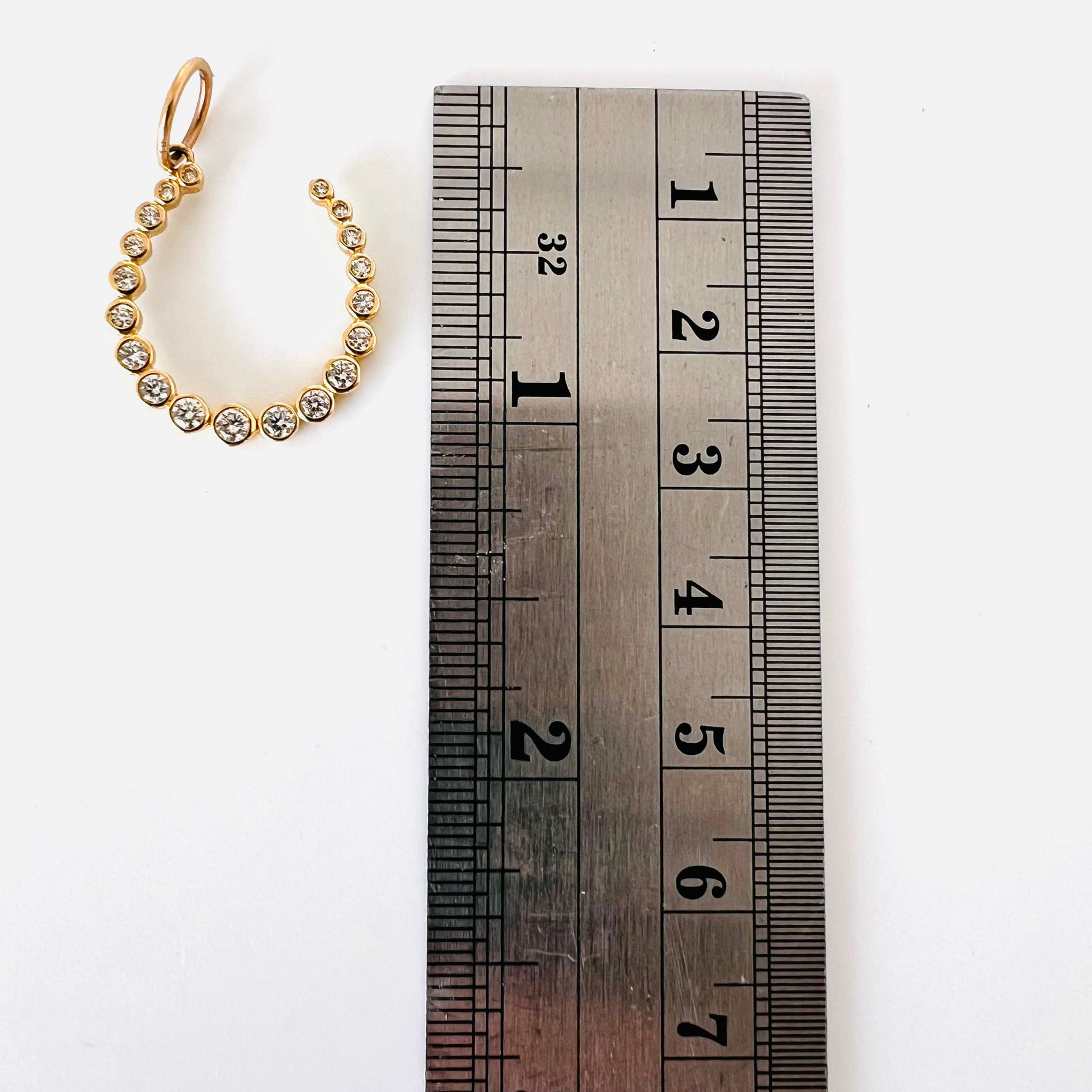 14k gold and bezel diamond horseshoe pendant