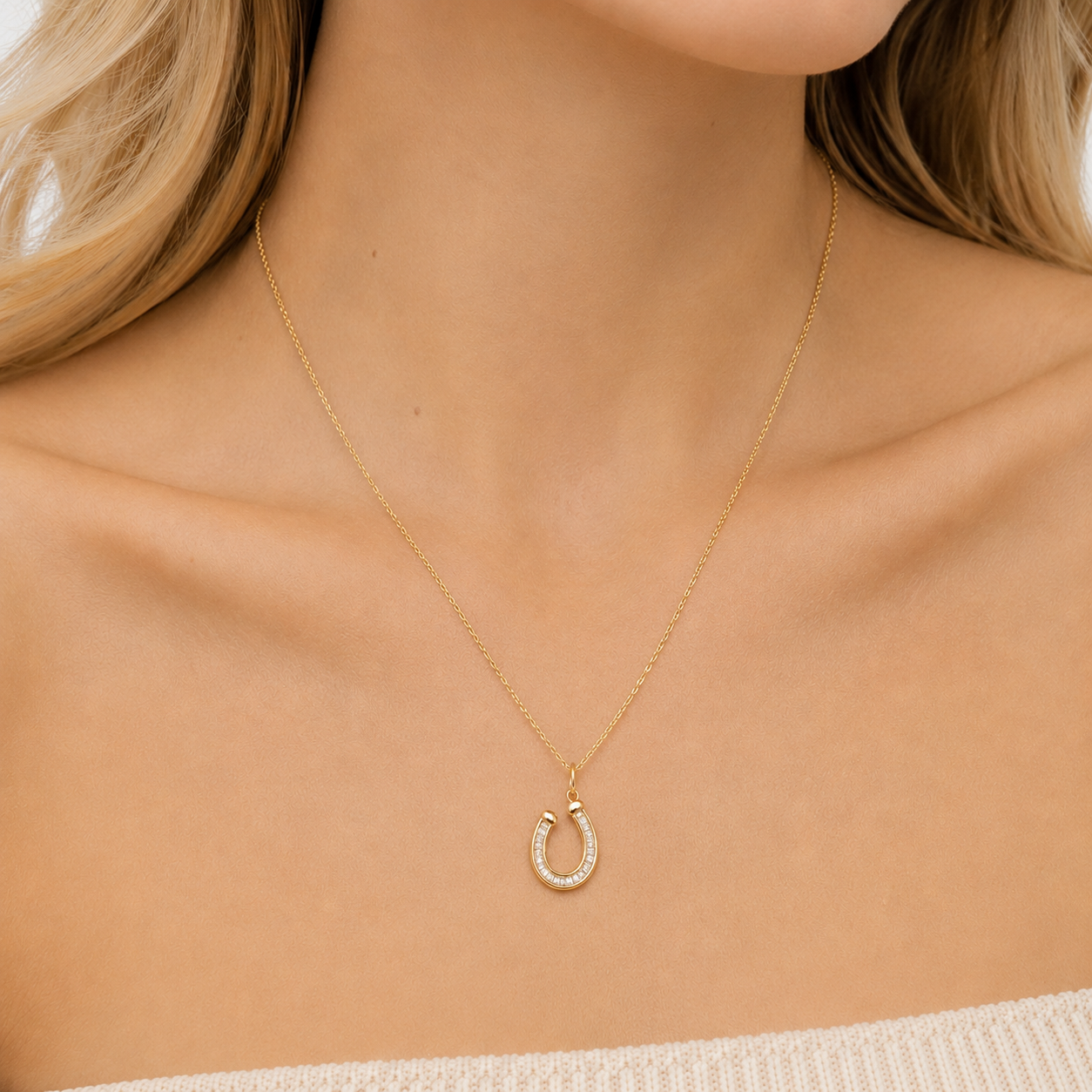 14K gold diamond baguette horseshoe pendant, close-up detail