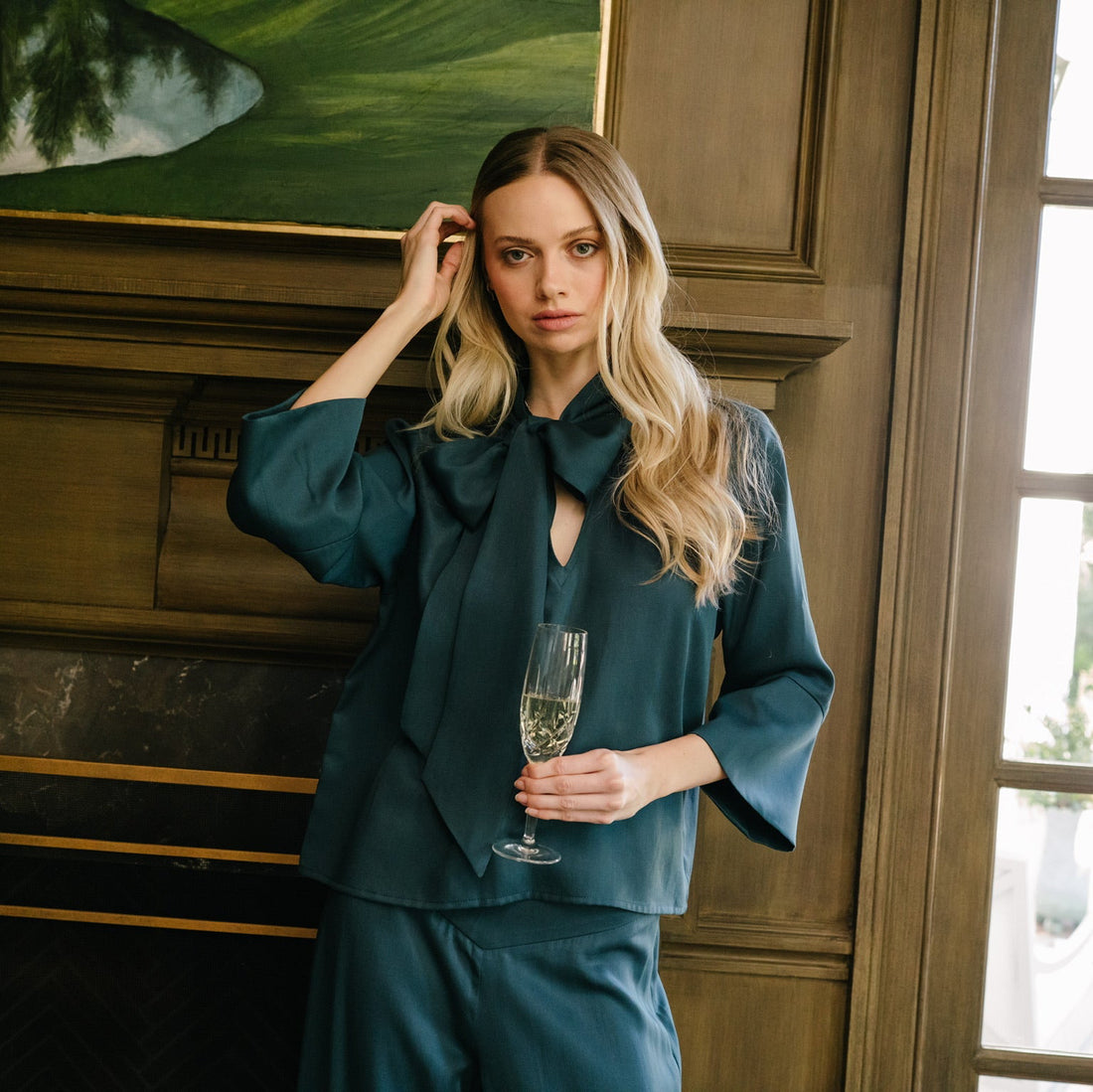 JAG peacock blue Tencel tie-neck top with 3/4 bell sleeves, styled with matching wide-leg pants