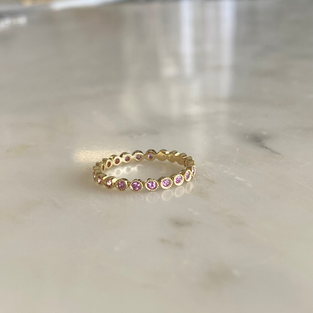 Round sapphire and gold ring